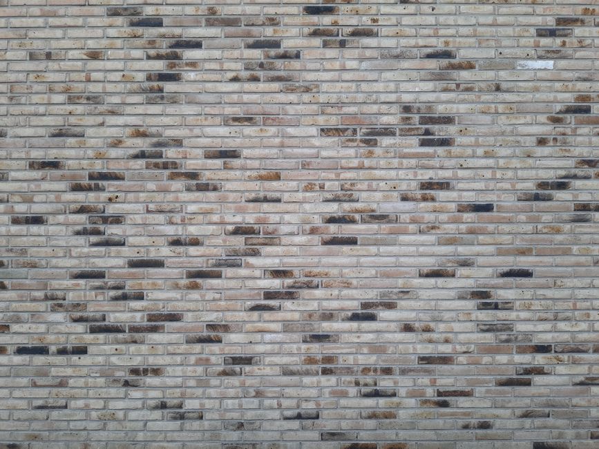 Mason cutting stone